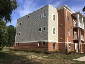 Right side of the apartment buildings.
