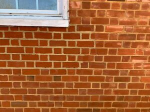 Brick repaired on building. 